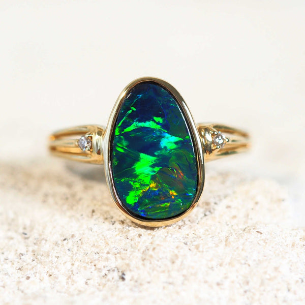 magnificent doublet opal gold ring with two shoulder-set diamonds