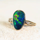 colourful australian opal ring in gold with two diamonds