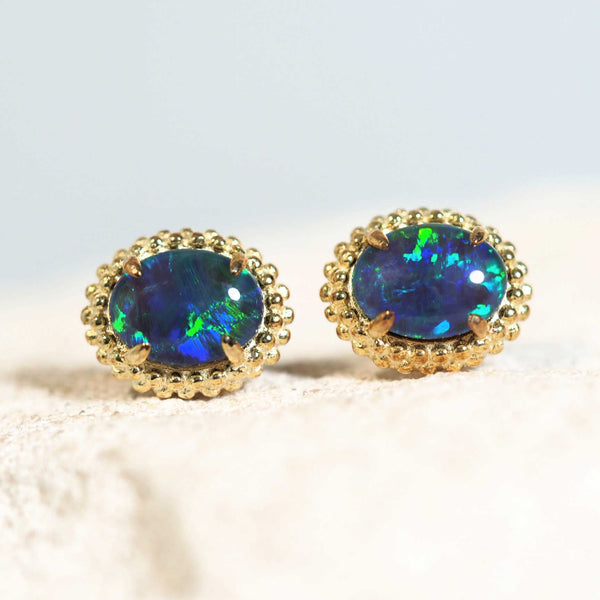 blue and green australian opal earrings in a blossom style