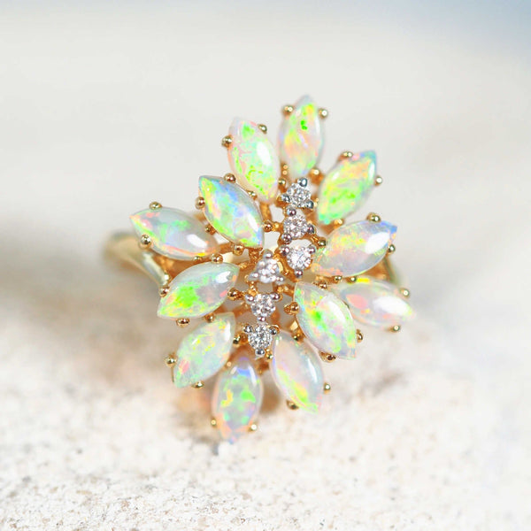 colourful marquise shaped crystal opals set into an ornate 18ct yellow gold ring