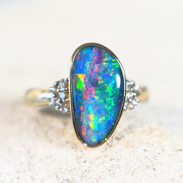 colourful australian opal ring set in gold with 10 diamonds