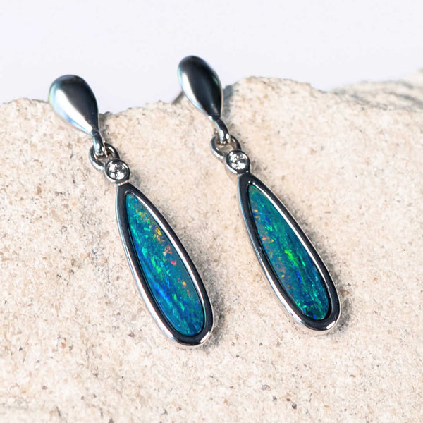 silver opal earrings set with blue and orange doublet opals