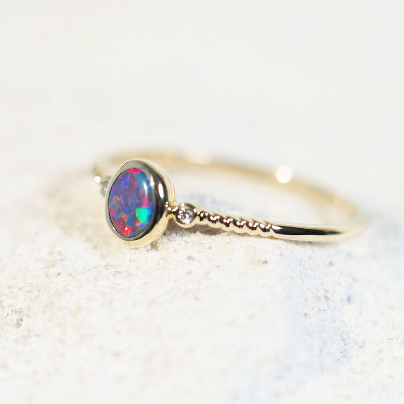 colourful black opal ring with diamonds