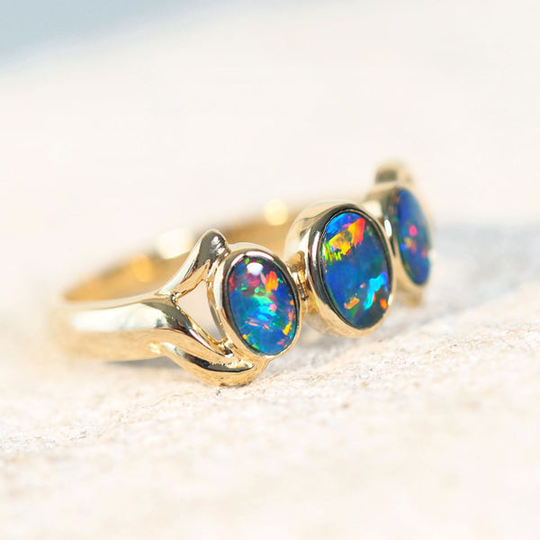 three colourful opals set into 14ct gold ring