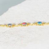 Gold-plated silver triplet opal bracelet featuring multi-color opals set in a heart design