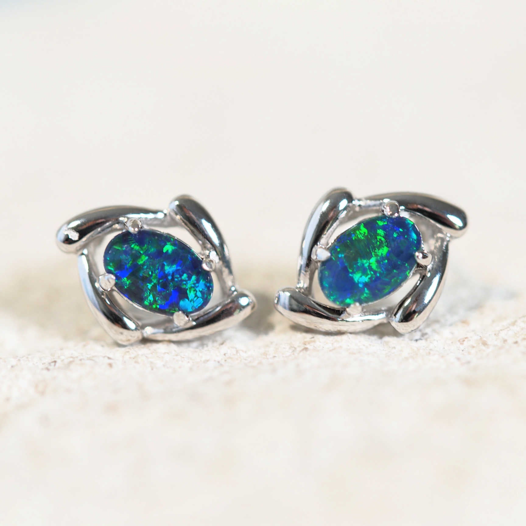 blue and green opal earrings set in sterling silver studs