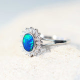 green and blue opal ring set with white sparkling diamonds