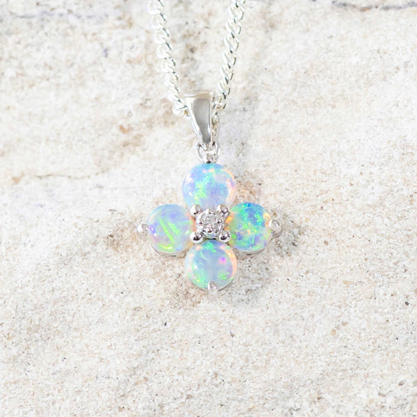 blue and green opal pendant set in white gold