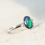 Elegant 14ct white gold Anneisha opal ring showcasing a green oval Lightning Ridge black opal with two dazzling white diamond accents.