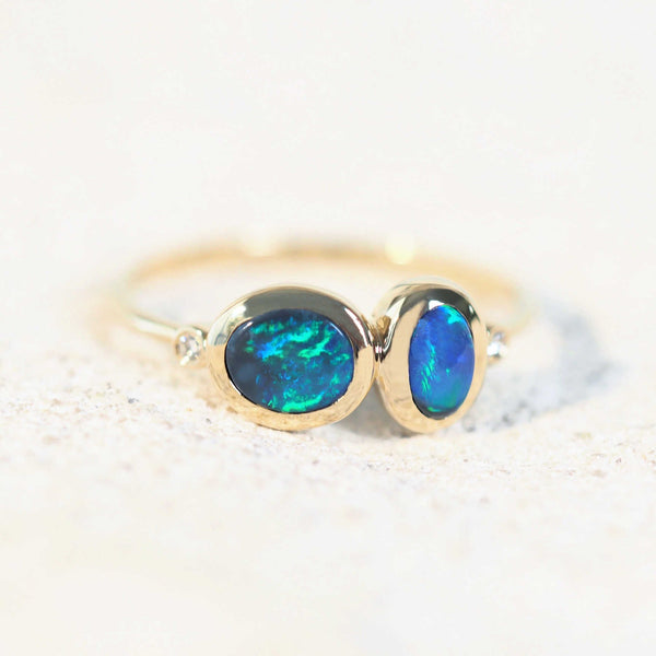 green and blue opal ring set with a black opal from lightning ridge