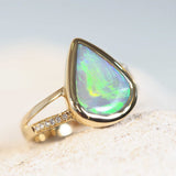 green opal ring set in gold with diamonds