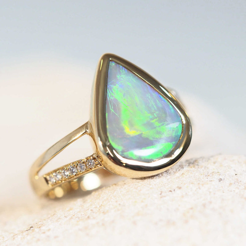 green opal ring set in gold with diamonds