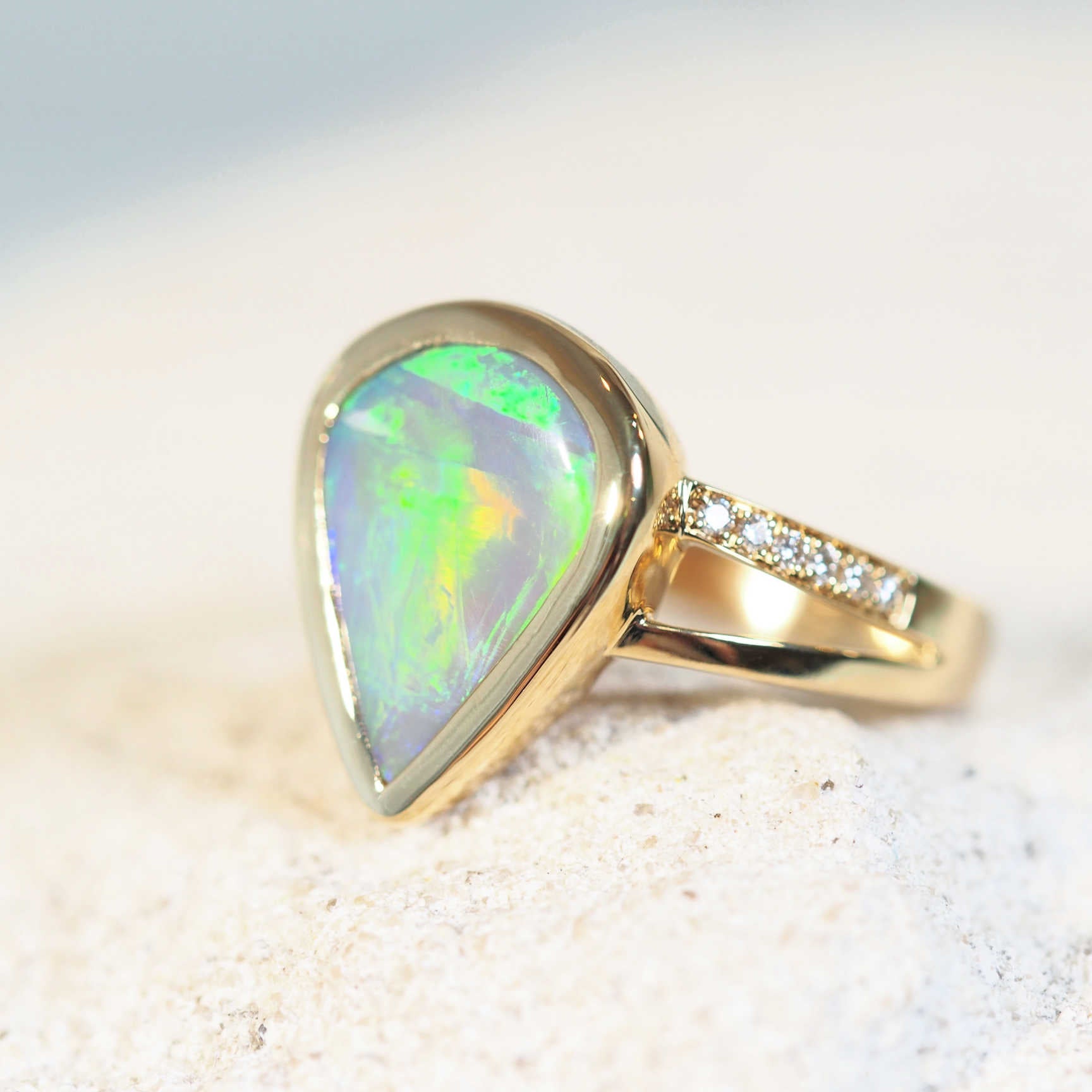 green and orange opal ring with diamonds