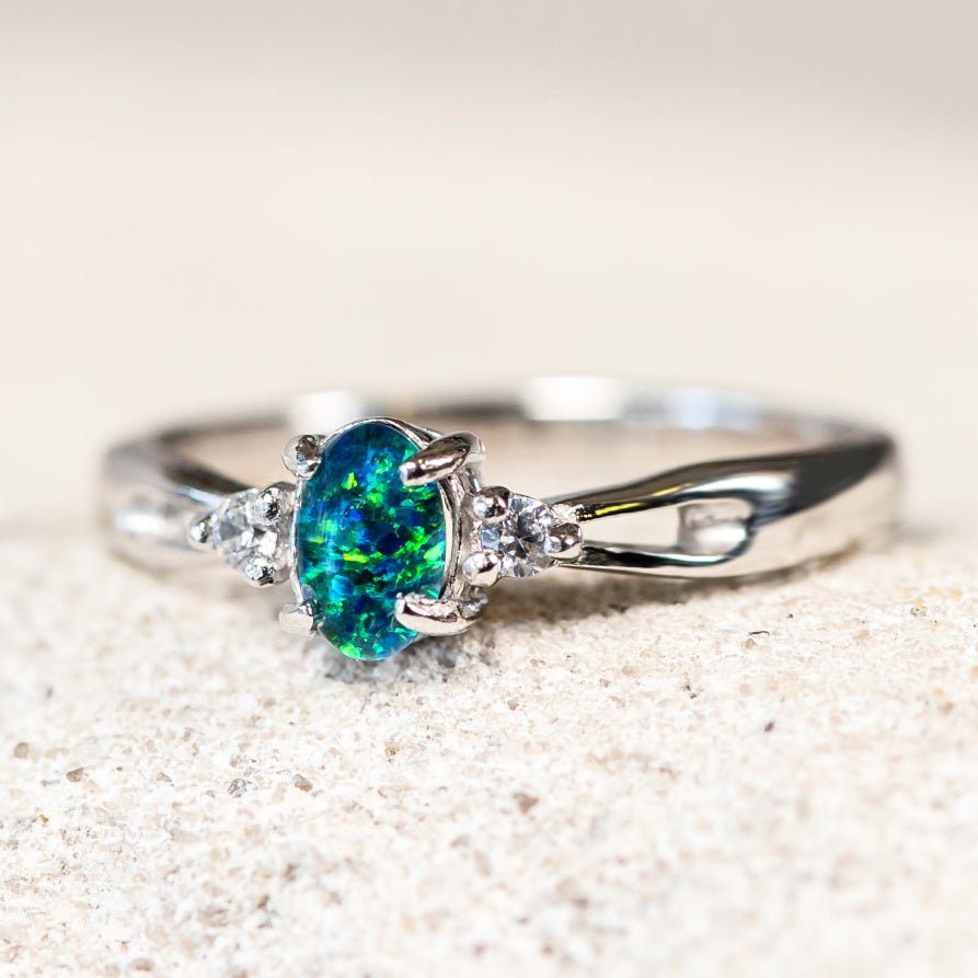 blue and green triplet opal set into a silver ring