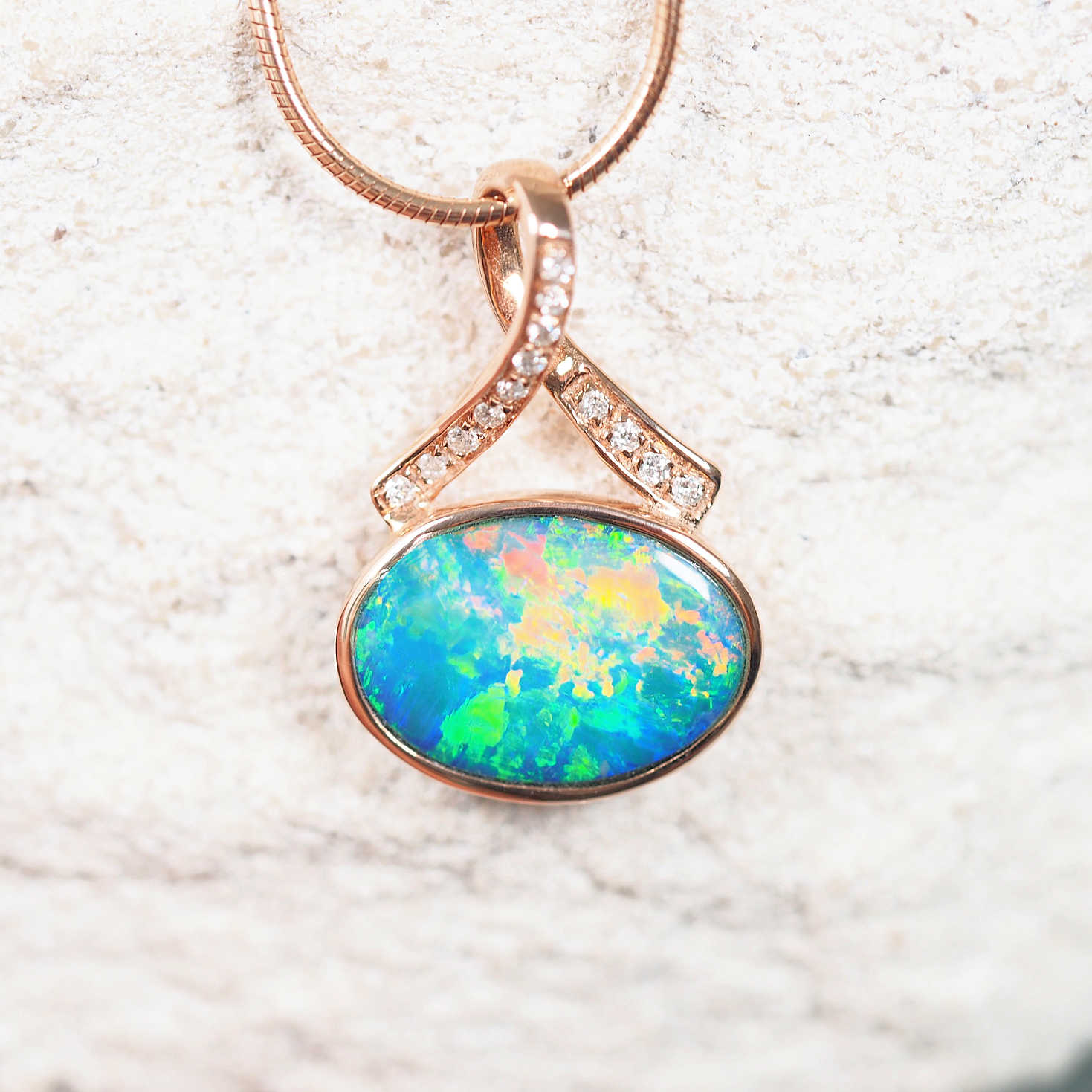 14ct rose gold opal necklace featuring an Australian doublet opal with sparkling white diamonds