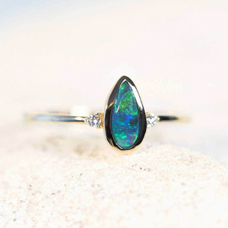 green and blue teardrop shape opal gold ring