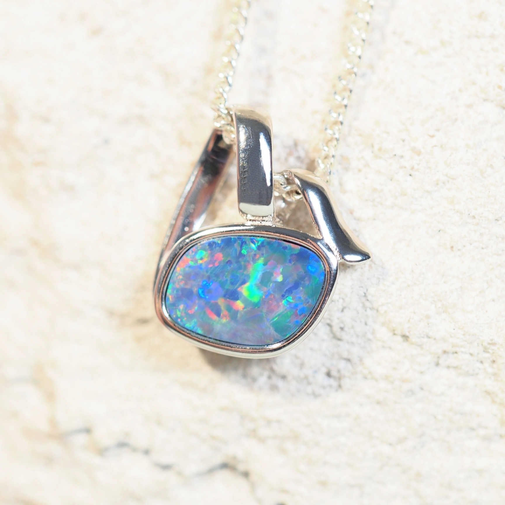 colourful opal pendant set in silver