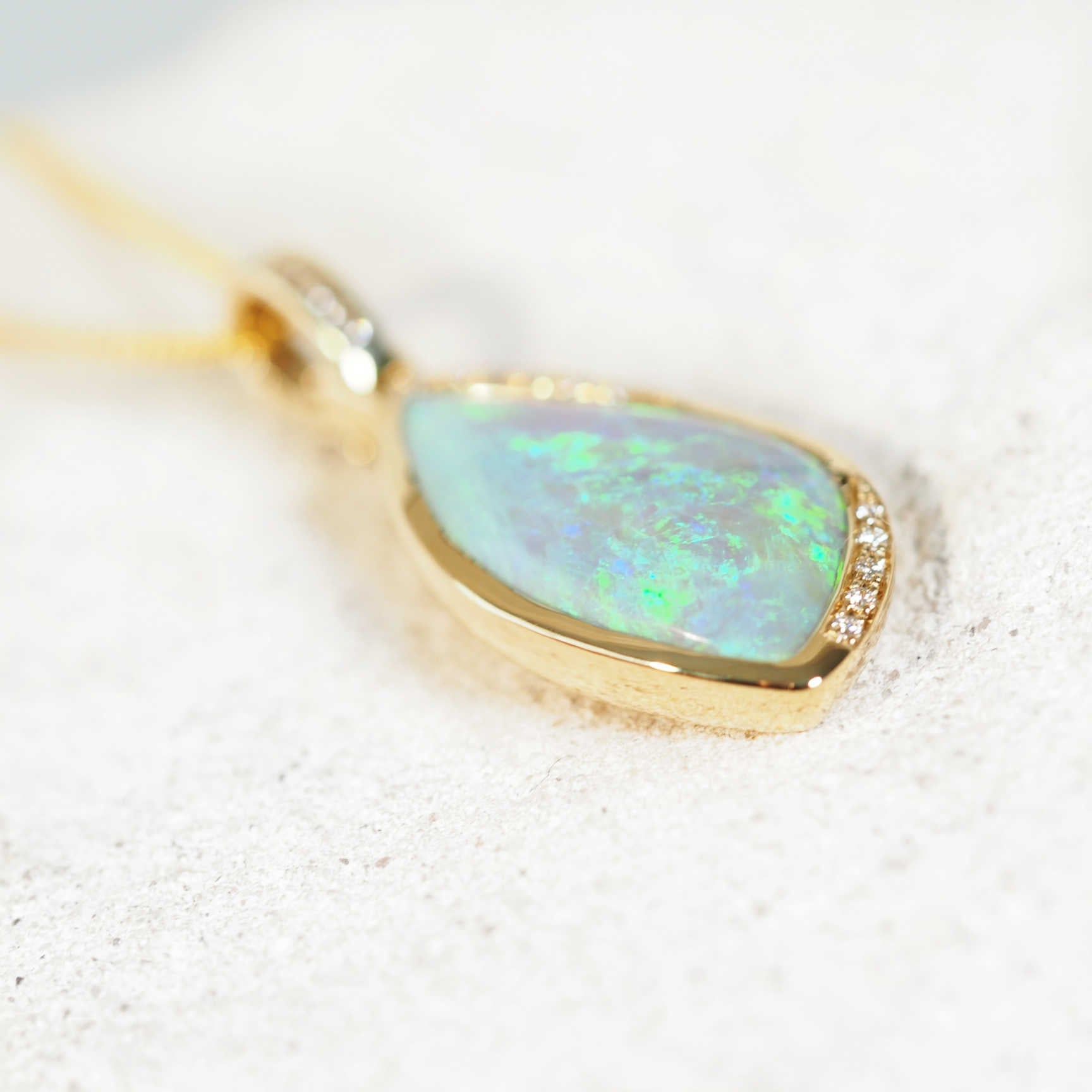 crystal opal pendant set in 14ct yellow gold