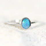 green and blue semi-black opal white gold ring