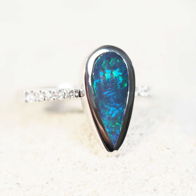 blue and green black opal white gold ring with diamonds