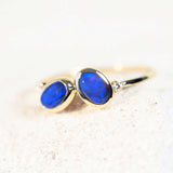 black opal ring in a blue colour set in gold