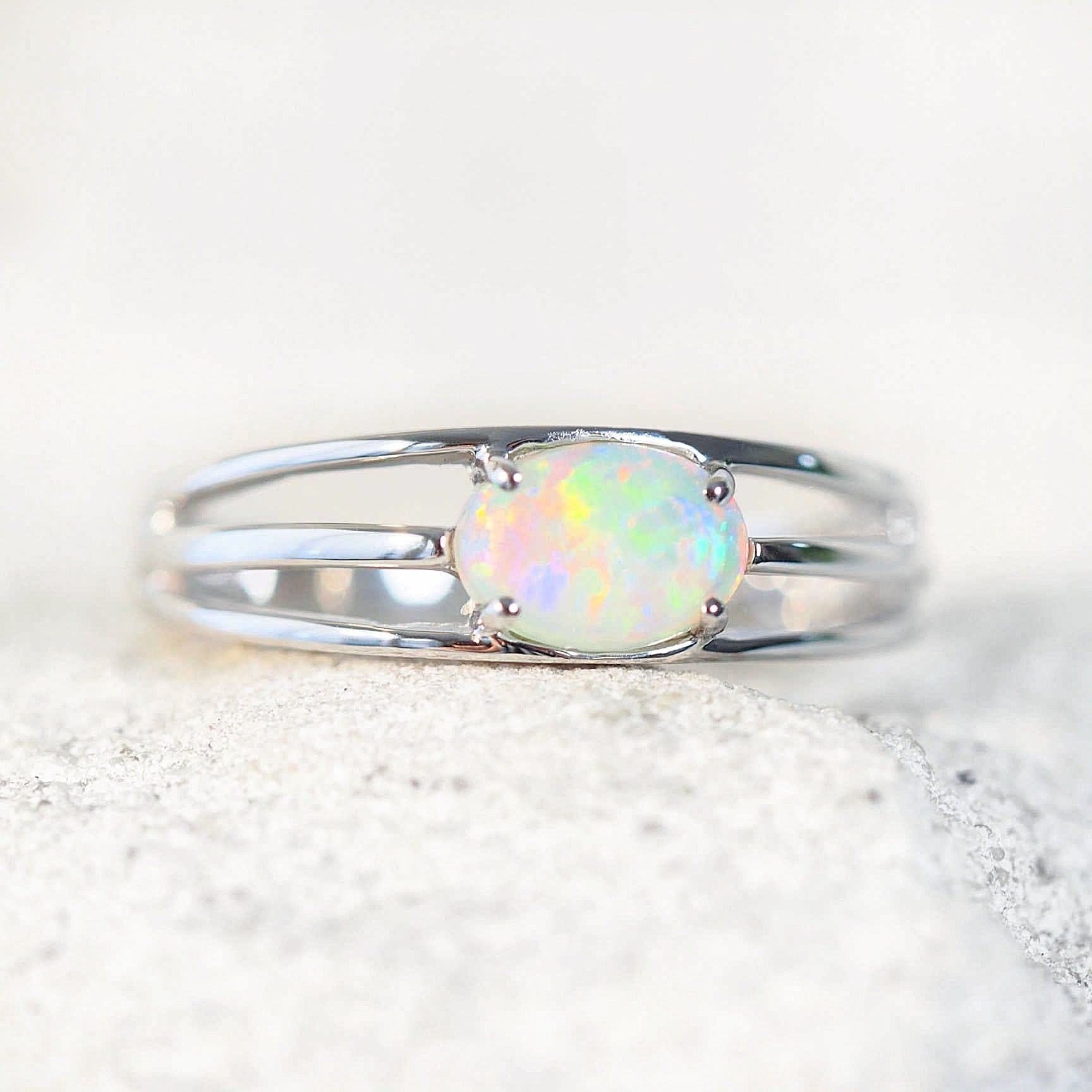 beautiful colourful opal ring horizontally set with a crystal opal 