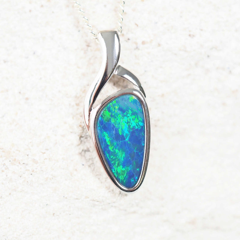 opal pendant set with a green and blue doublet opal