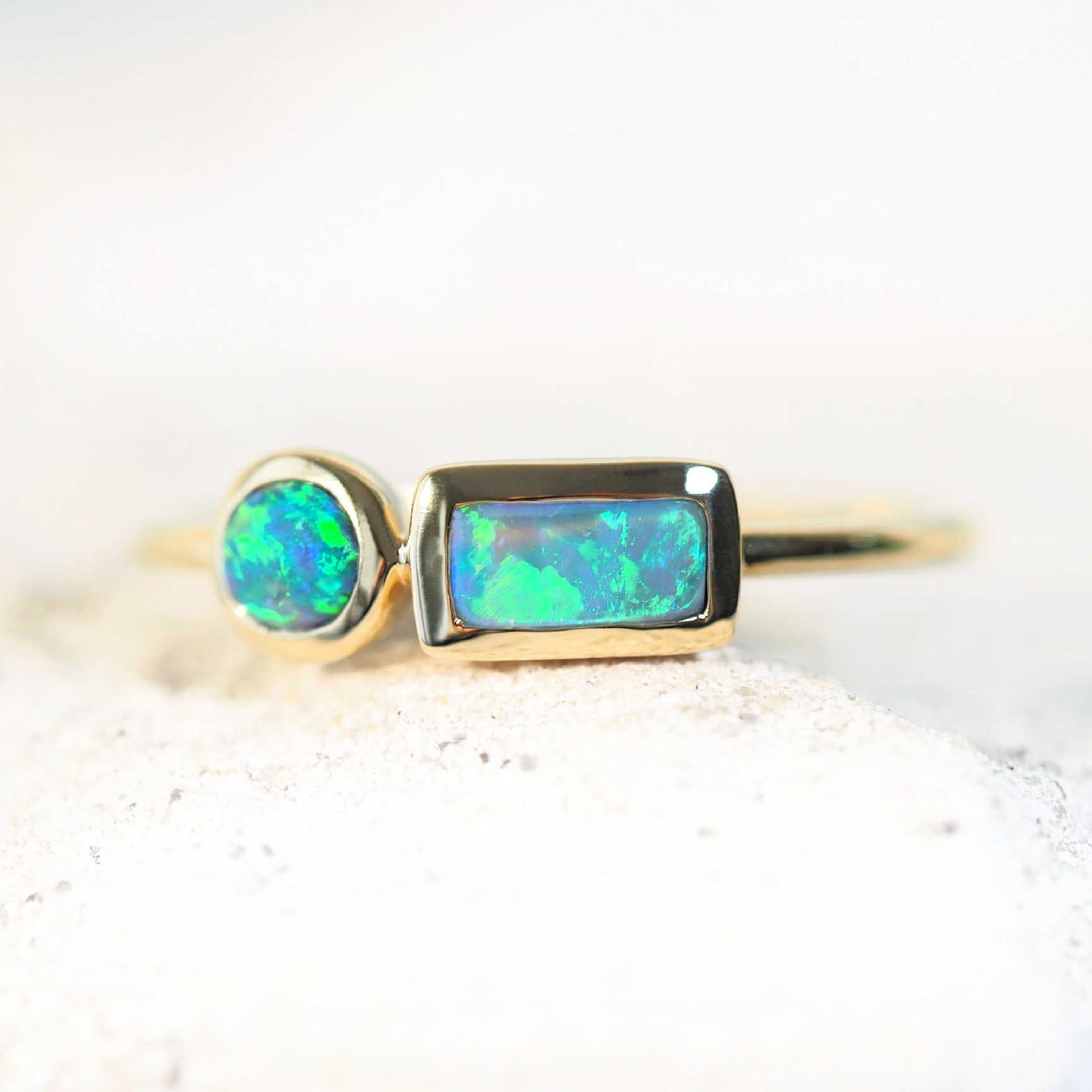 green and blue opal ring set in gold