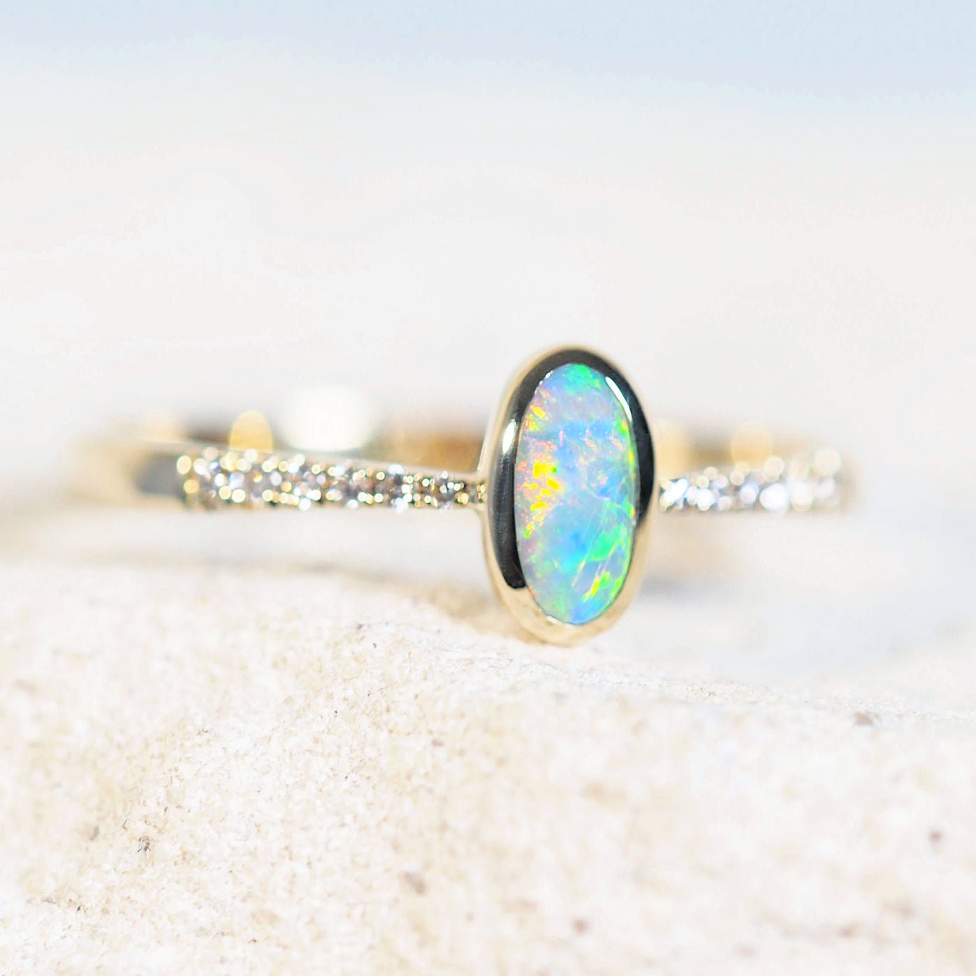 colourful black opal ring in 14ct yellow gold