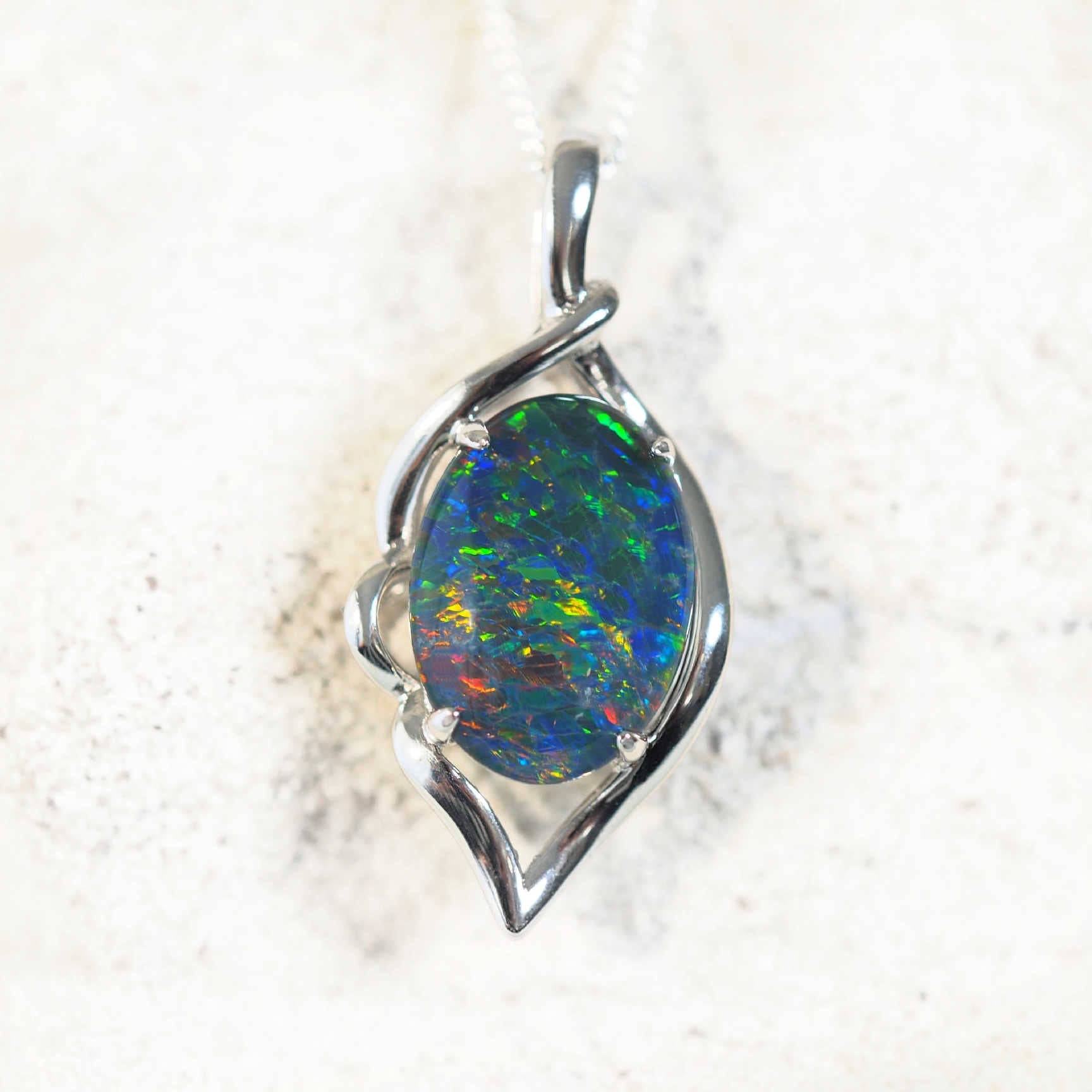 colourful oval opal pendant set in sterling silver