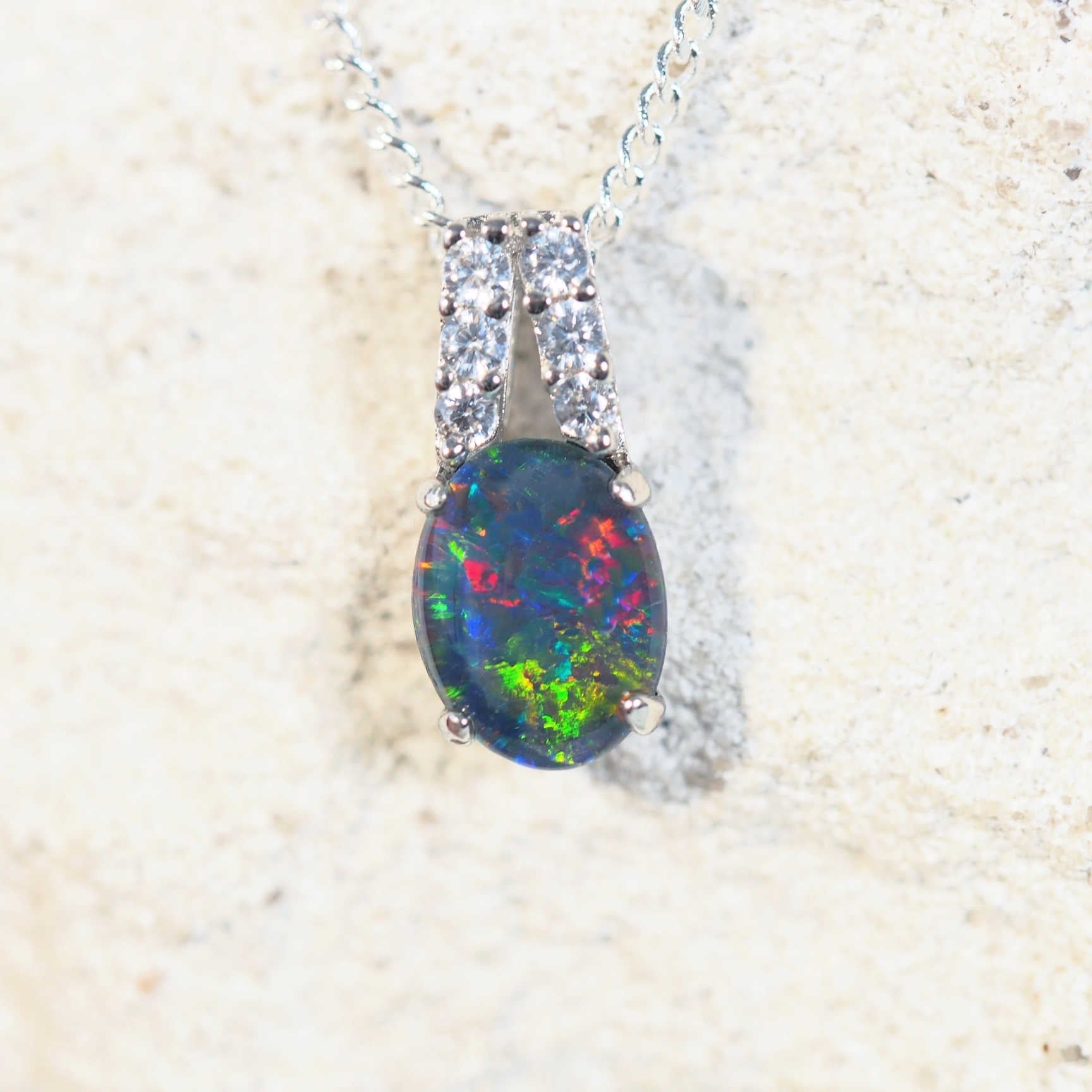 close up of danike silver opal pendant