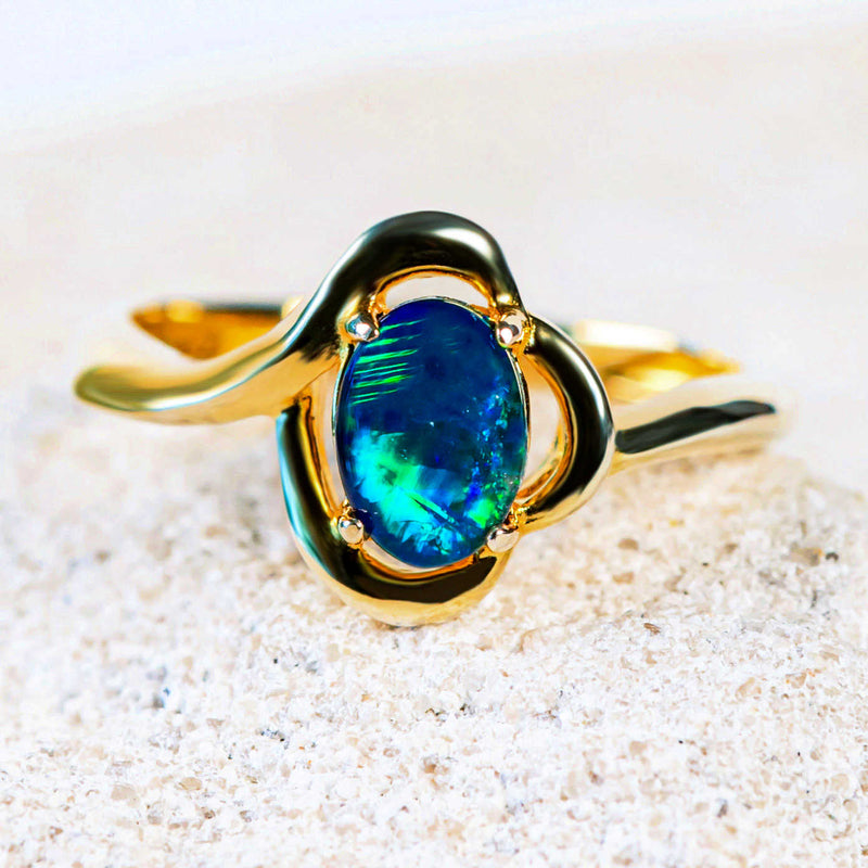 opal ring set in gold plated silver with a scallop design