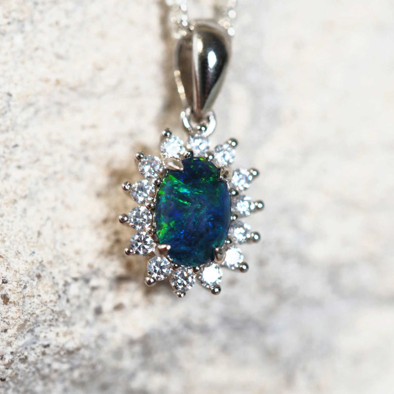 sparkling opal pendant with a green and blue opal