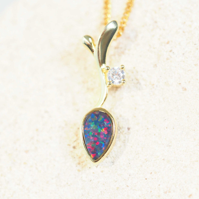 australian opal pendant with a leaf design set in gold plated silver