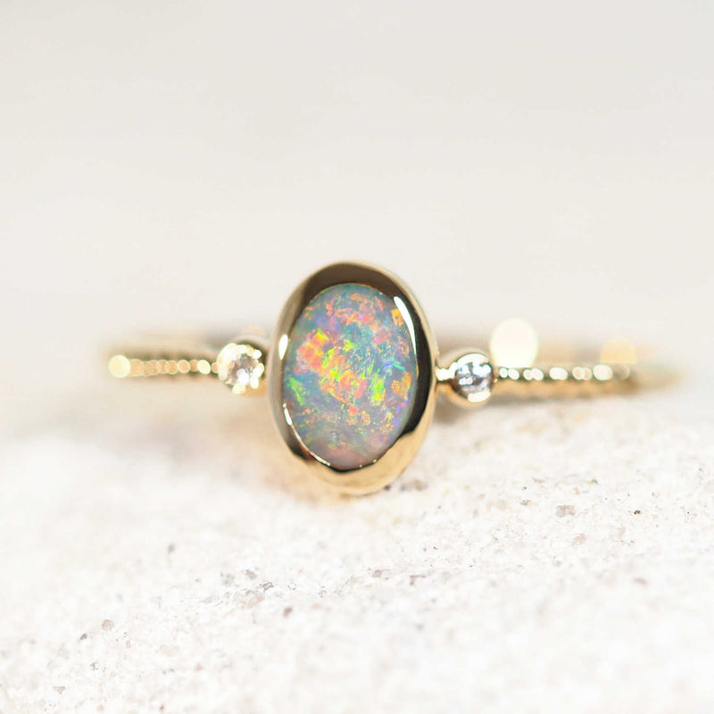 multi-colour Lightning Ridge black opal gold ring with two diamonds