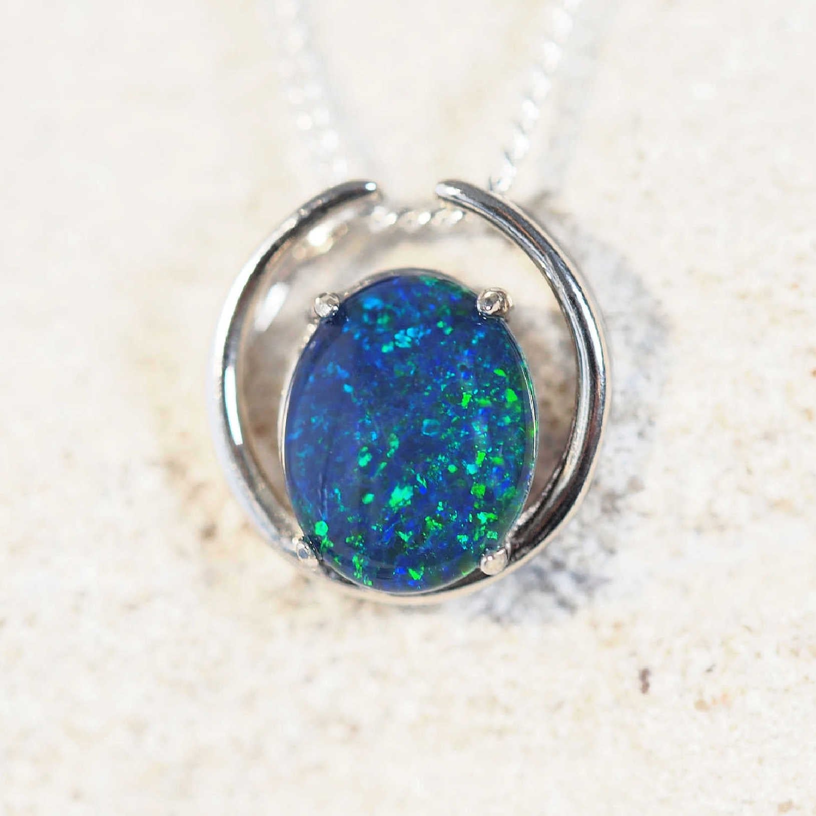 blue and green oval opal pendant in silver