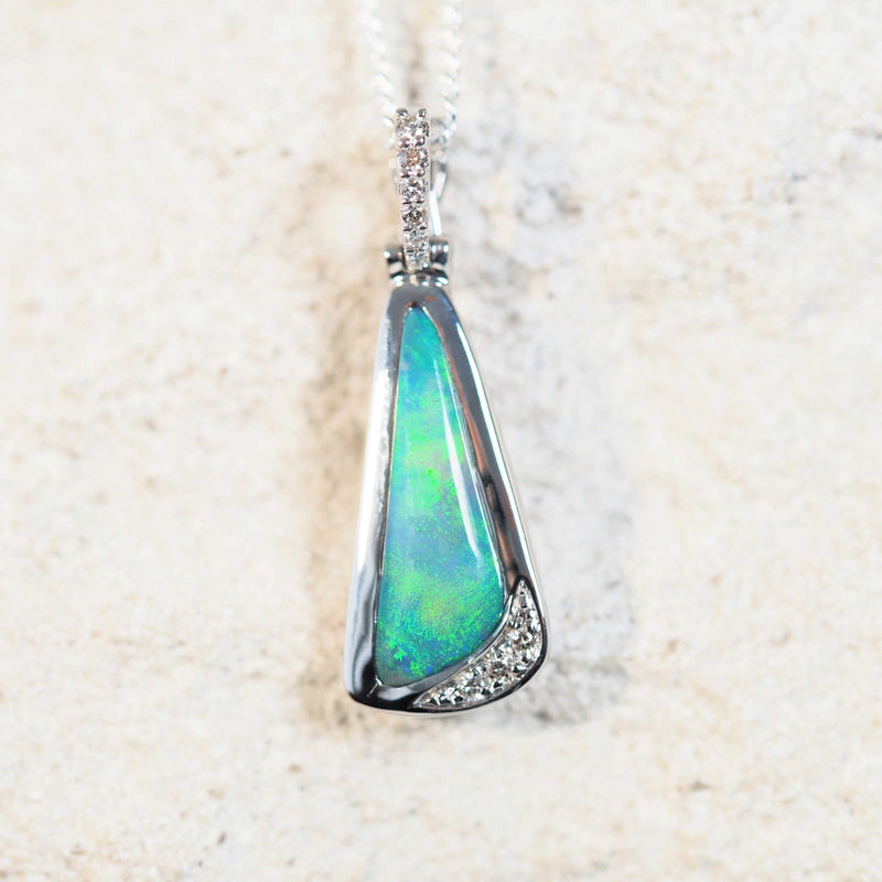 white gold pendant set with a lightning ridge black opal