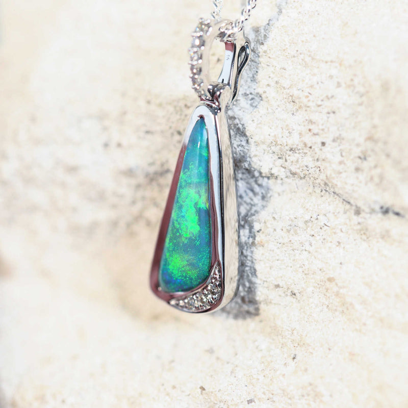 black opal pendant set in white gold with a green opal stone