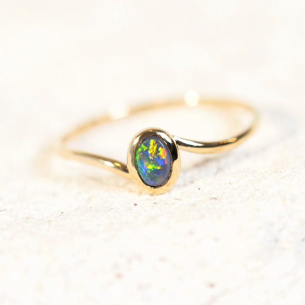 black opal ring set with a lightning ridge opal in gold