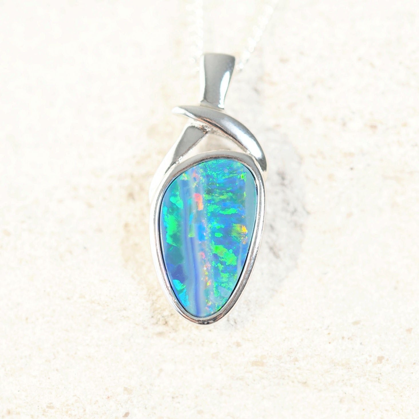 colourful opal pendants in silver