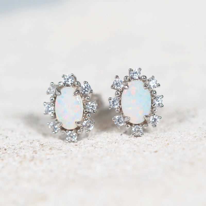 Empress sterling silver stud opal earrings with multi-coloured South Australian solid crystal opals and eight sparkling cubic zirconias per earring.