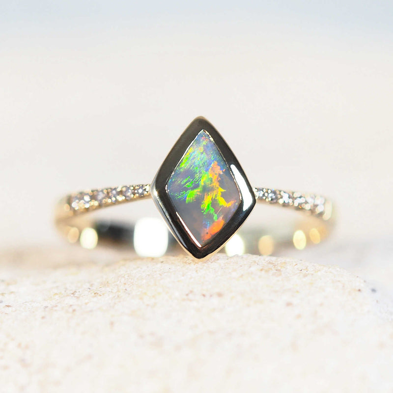 greeb, yellow, blue and orange black opal ring set in gold