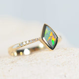 semi-black opal gold ring with diamonds