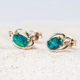 closeup of opal earrings set with australian opals