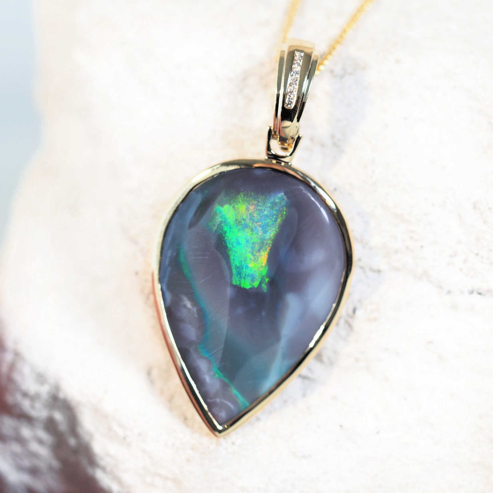 black opal gold pendant with multicolour splash