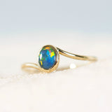 colourful black opal ring set in 14ct yellow gold