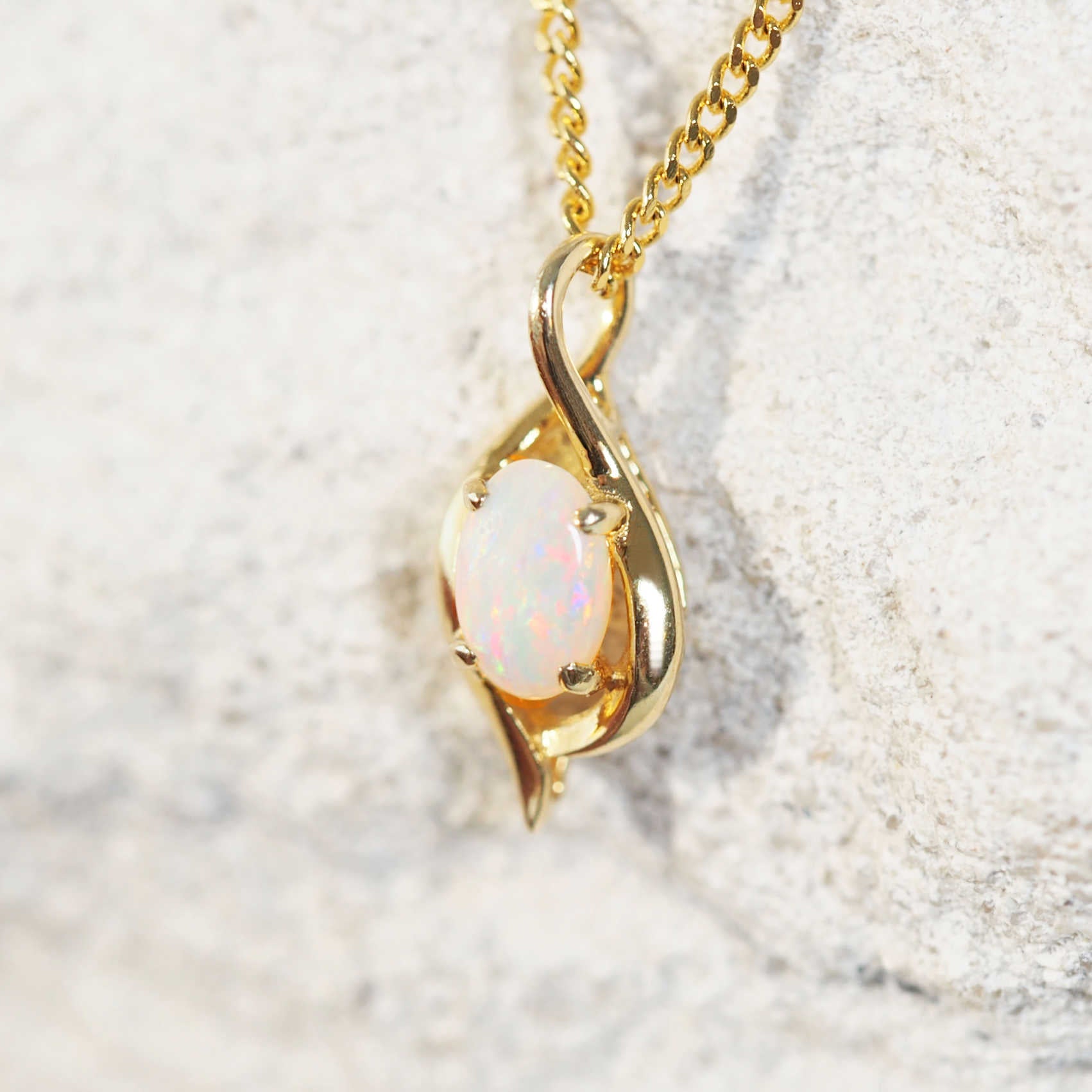 colourful and delicate opal pendant in gold plated silver