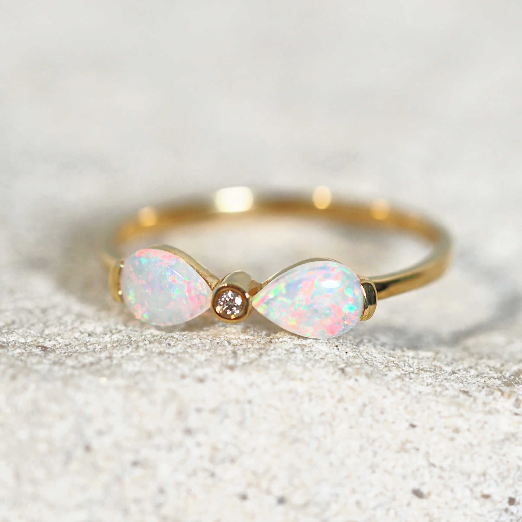 pastel coloured crystal opal gold ring with one diamond