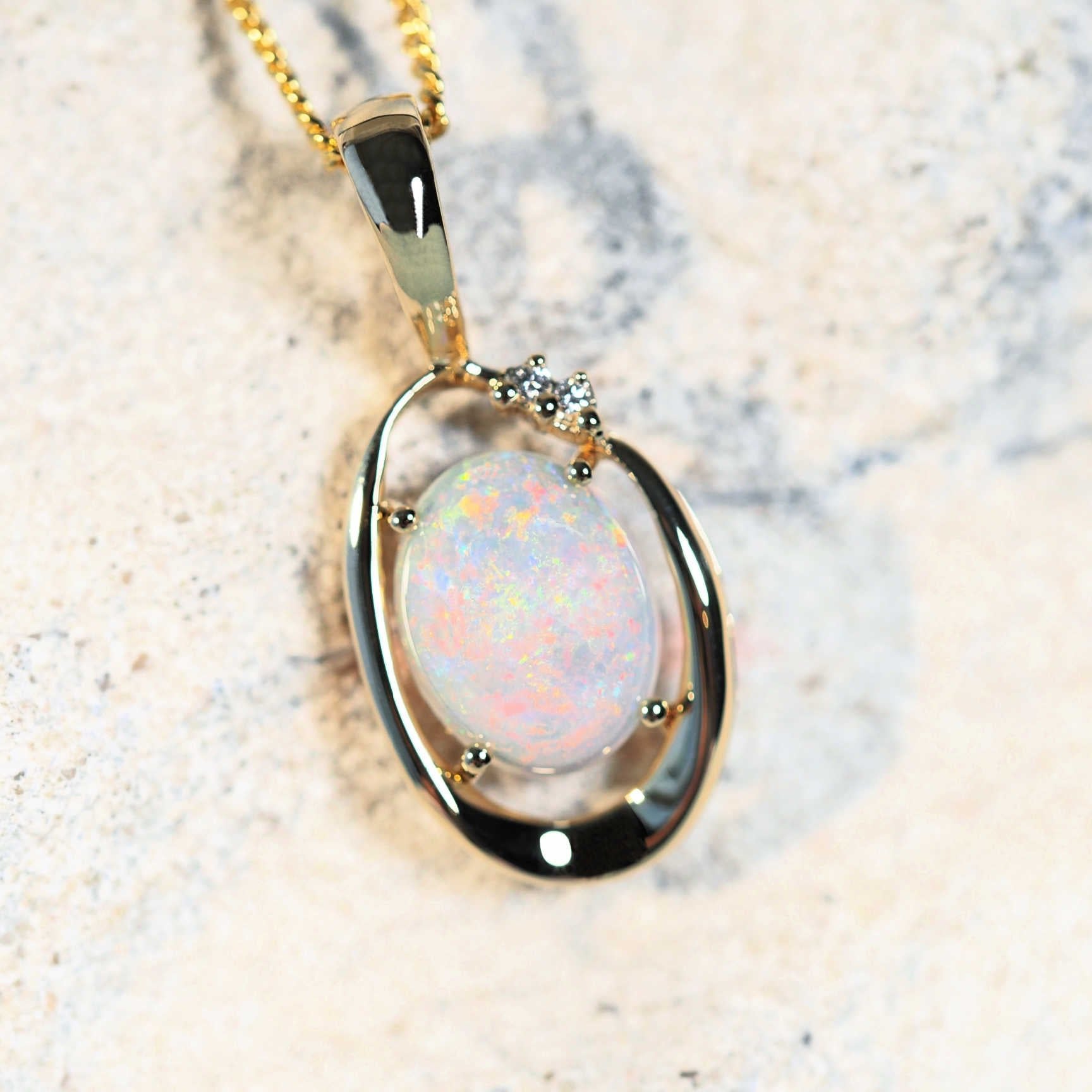 white opal pendant set with diamonds