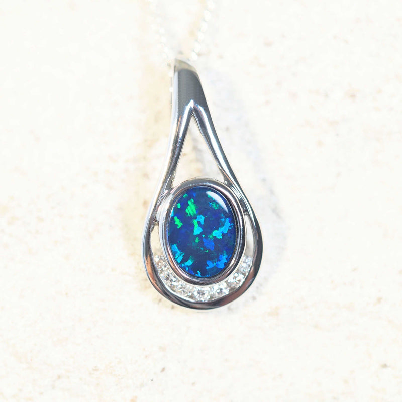 blue and green doublet opal pendant with seven diamonds